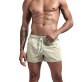 Shorts de praia masculinos por atacado que executam shorts esportivos