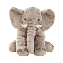 A stuffed elephant standing on four legs