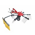 Tractor mounted hay raker