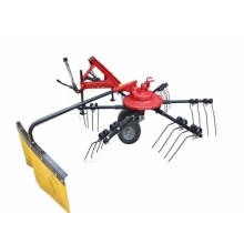 Tractor mounted hay raker