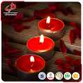 Scented red tealight candles in plastic cup