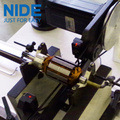 Automatic positioning armature dynamic balancing machine