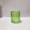 Colorful embossed glass candle holders decorate gifts