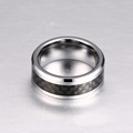 Tungsten carbide ring with carbon fiber inlay