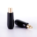 Black glass bottle with golden aluminum cap