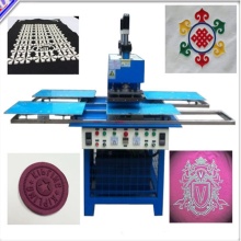 Silicone logo moulding machine onto clothes