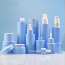 Blaue Kosmetikcreme und Lotionflaschensets