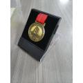 Raised gold logo metal medal with ribbon