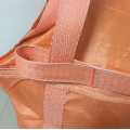 White bulk bag with orange belt