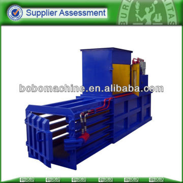 horizontal baler with manual belting