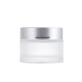 wholesale 10g 20g 30g 50g 100g sustainable transparent glass cosmetic jars frosted with silver lids