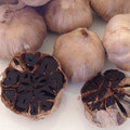 Uncracked whole black garlic with skin in jar