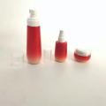 Conjunto de frasco de vidro cosmético gradiente vermelho