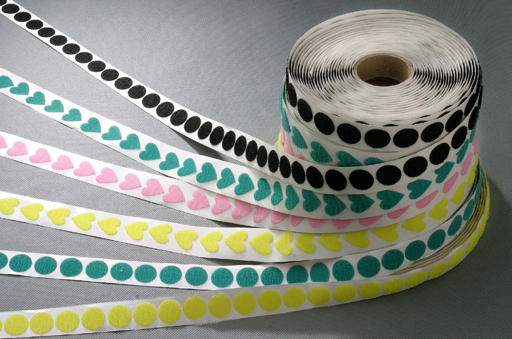 Colored adhesive hook and loop