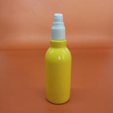 Желтая стеклянная бутылка для лосьона с насосом