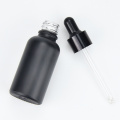 factory wholesale essential oil 1oz 2oz empty matte black cosmetic glass bottle abd dropper