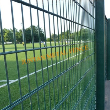 Welded double wire mesh fence with barbed wire