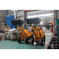 Small front end loader with backhoe