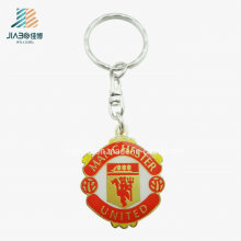 Top Sell Aleación de zinc Red Fill Color Deboss Metal Gold Keychain para United