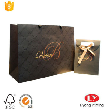 Элегантный штамповочный бумажный подарочный пакет с логотипом оптом
