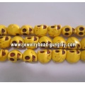 Howlite skull beads - yellow