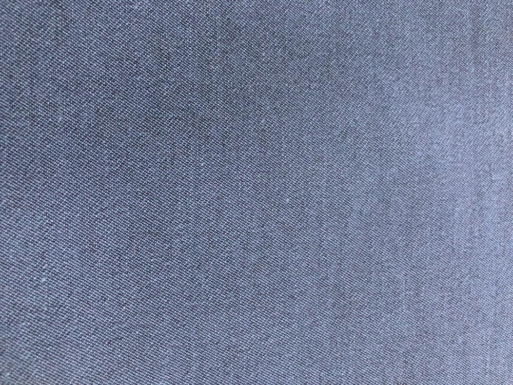 Textured double -faced denim fabric