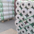 Round roll bale wrapping net for baler