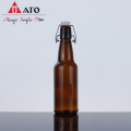 Botella de cerveza de vidrio redonda con top swing top