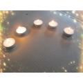 White pressed paraffin wax tealight candle