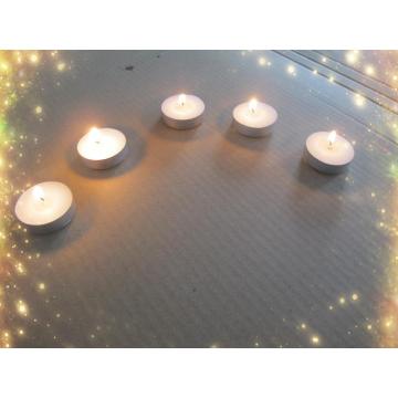 White pressed paraffin wax tealight candle