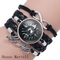 Game of Thrones Bracelet en cuir tressé avec logo en dôme Stark Wolf