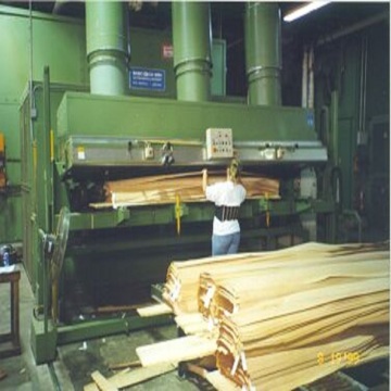 Rotary veneer peeling machine for wood cutting