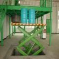 Elevador de tijera hidráulico estacionario Almacén Elevador de tijera de carga