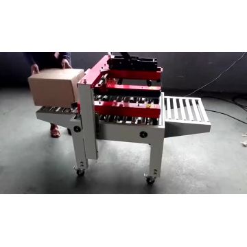 Автоматическая машина для запечатывания картонных коробок с клейкой лентой