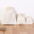 The canvas drawstring bag carries a beaded bag