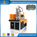 Plastic injection molding machine with rotary