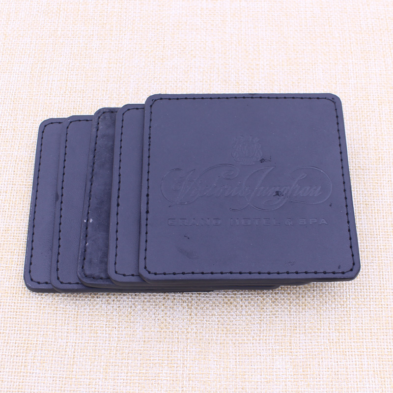 China Supply Cheapest Logo Debossed Black PU Leather Coaster