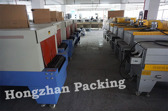Fast Heat Shrinking Wrapping Machine with Roller Link Plate Stainless Steel Heating Pipe for Small Carton Box Film Wrap Tightly Packing