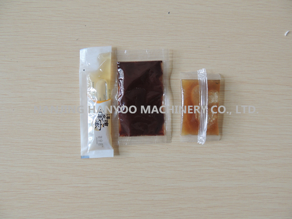 Automatic Liquid/Shampoo/Oil/Lotion/Honey Sachet Packing Machine (DXD-Y)