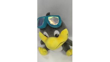 Grey duck stuffed animal with swimming goggles