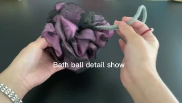 purple and black bath ball