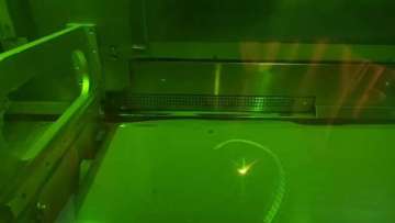 Customized 3D-printed handlebar being printed