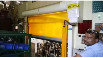 Fabric rapid rolling door for robotic welding cell