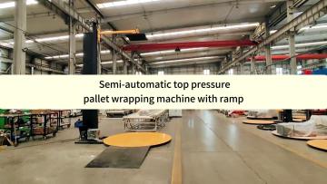 Top pressure pallet wrapping machine with ramp