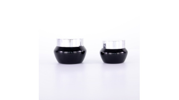 Black oblique shoulder cream jar with silver spray lid