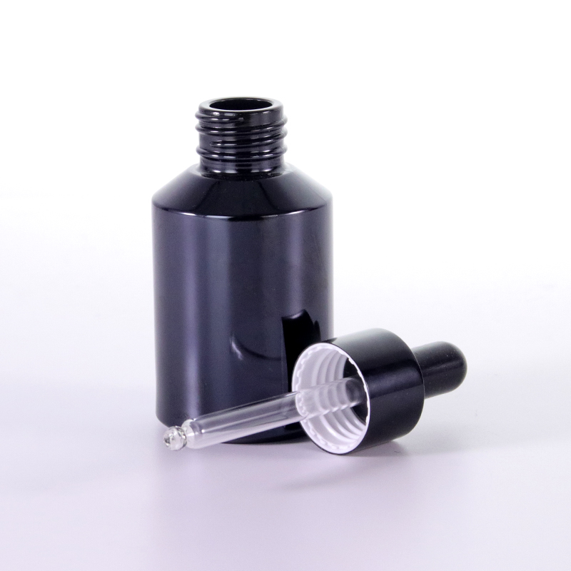 Black oblique shoulder dropper bottle dropper detail