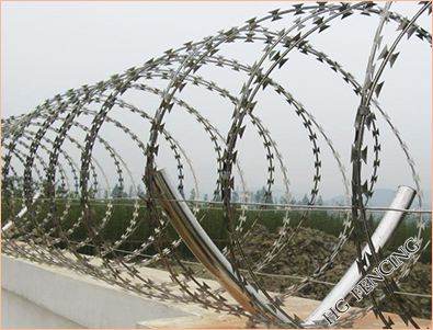 concertina barbed wire installed on the wall 